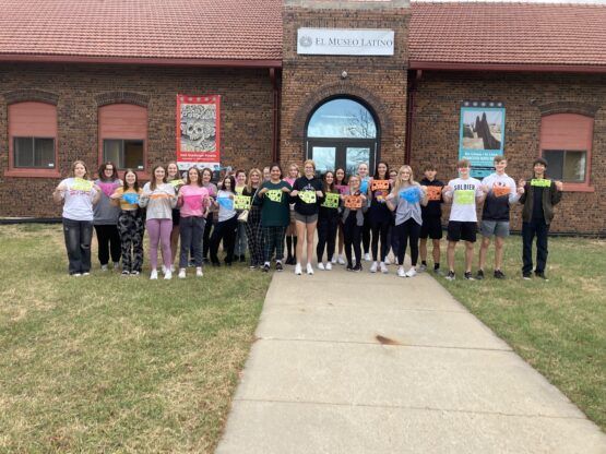 Spanish Club outside the Museo Latino in Omaha holding the papel picado that they made during our visit